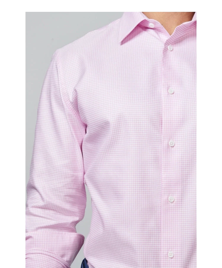 Man wearing a long sleeve pink shirt